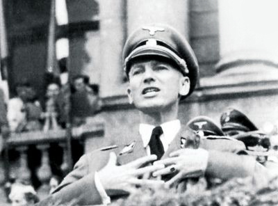 Governor of Galicia, Otto Wächter, showing off at a rally in front of the newly recruited SS Galicia Division.